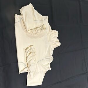 Lovely cream turtleneck with light grey stitching